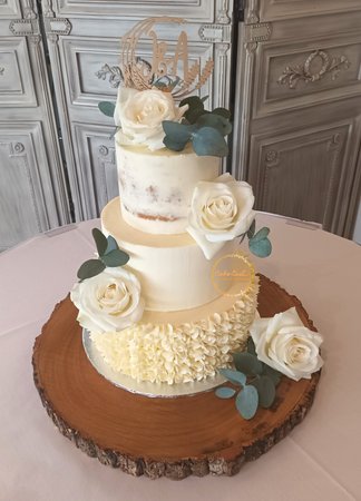 Three Tier Buttercream Wedding Cake with fresh flowers